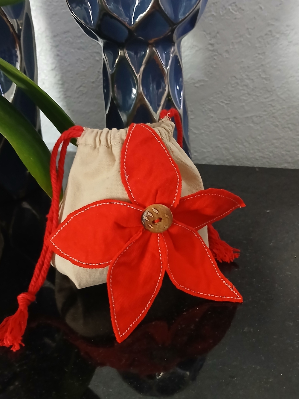 Handcrafted Beige Mini Drawstring Bag with Red Flower Accent